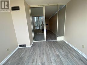 Toronto (Newtonbrook East) condo for rent - A room with a sliding door leading to another room.
