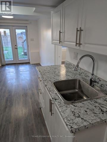 Innisfil (Alcona) townhouse for rent - A kitchen with a sink and cabinets.