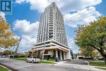 Toronto (Islington-City Centre West) condo for rent - A tall building with a glass facade is the main focus of the image.