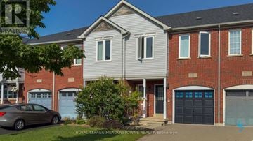 Mississauga (Churchill Meadows) townhouse for rent - A house with a car parked in front of it.