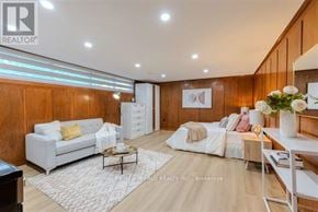 Toronto (Bathurst Manor) apartment for rent - A well-lit, modern living room with a white sofa set and a coffee table.