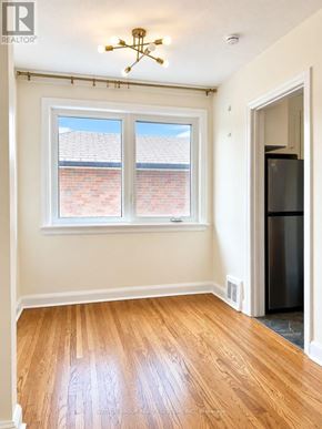 Toronto (Downsview-Roding-Cfb) apartment for rent - A room with a window and a ceiling fan.