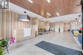 Kitchener condo for rent - A modern office lobby with a wooden ceiling and a reception desk.