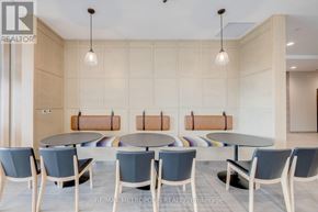 Kitchener condo for rent - A conference room with a table and chairs.