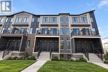 Ottawa townhouse for rent - A multi-story residential building with balconies and doors.