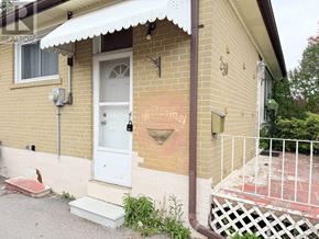 Richmond Hill (Crosby) apartment for rent - A house with a white door and a sign that says "For Sale".