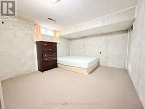 Richmond Hill (Crosby) apartment for rent - A bedroom with a bed, dresser, and carpeted floor.