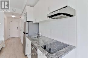 Oshawa (Samac) condo for rent - A modern kitchen with a granite countertop and stainless steel appliances.