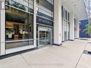 Toronto (Church-Yonge Corridor) condo for rent - The entrance to a building with the sign 77 Mutual St.