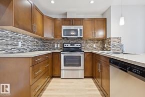 Edmonton apartment for rent - A modern kitchen with wooden cabinets and stainless steel appliances.