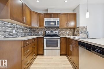 Edmonton apartment for rent - A modern kitchen with wooden cabinets and stainless steel appliances.