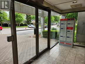 London North (North N) condo for rent - The entrance to a building with a glass door and a sign that says "REALTOR".