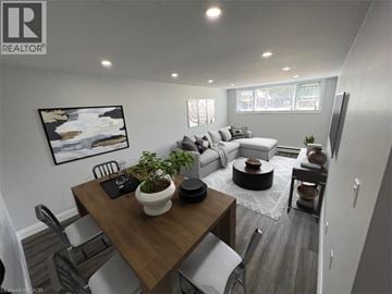 Kitchener apartment for rent - A modern living room with a dining table and chairs.