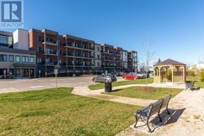 Clearview (Creemore) condo for rent - A large building with a parking lot in front of it.