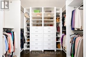 Toronto (Leaside) townhouse for rent - A white closet with drawers and clothes.