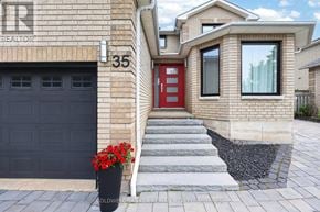 Barrie (Holly) apartment for rent - A house with a red door and a black garage door.