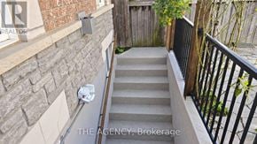 Vaughan (Patterson) apartment for rent - A staircase with a metal railing and a brick wall.