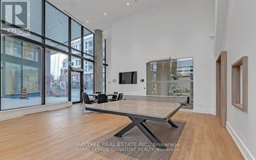 Toronto (Downsview-Roding-Cfb) condo for rent - A spacious living room with a large table and chairs.