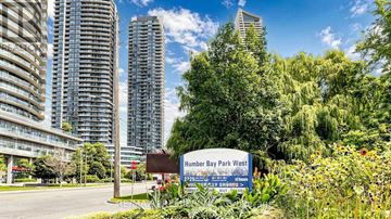 Toronto (Mimico) condo for rent - A sign for Humber Bay Park West stands in front of a row of tall buildings.