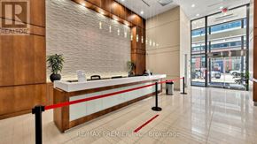 Toronto (Mimico) condo for rent - A reception area with a red rope barrier.