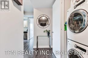 Toronto (Mimico) condo for rent - A laundry room with a washer and dryer in it.