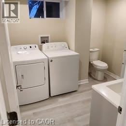 Hamilton apartment for rent - A bathroom with a washer and dryer built into the cabinetry.