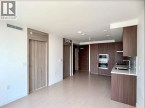 Vancouver apartment for rent - A modern kitchen with wooden cabinets and appliances.