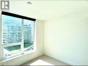 Vancouver apartment for rent - A realtor logo is on a window in a white room.