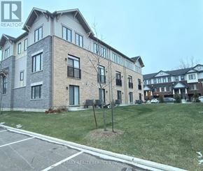 Hamilton (Stoney Creek Mountain) townhouse for rent - A building with a sign that says RE/MAX Realty Services Inc.
