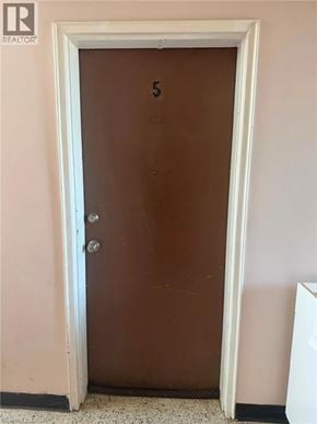 Waterloo apartment for rent - A brown door with a number 5 on it.