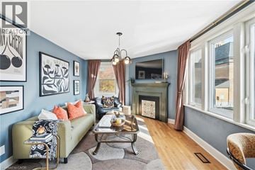 Hamilton apartment for rent - A living room with a green couch and a coffee table.