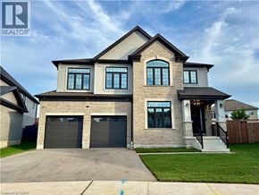 Kitchener apartment for rent - A two-story house with a garage is for sale.
