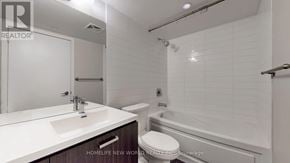 Toronto (Mount Pleasant West) condo for rent - A white sink and toilet in a bathroom with a white tiled wall.
