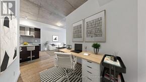 Toronto (South Riverdale) condo for rent - A modern office space with a desk, chairs, and a laptop.