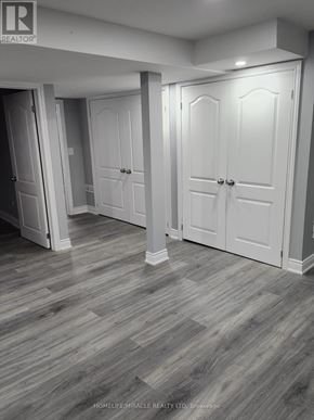 Brampton (Madoc) apartment for rent - A room with white doors and grey flooring.