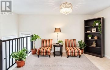 Toronto (Humberlea-Pelmo Park) apartment for rent - A living room with a striped couch and a lamp.