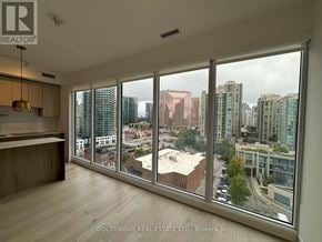Toronto (Willowdale East) condo for rent - A room with a large window overlooking a cityscape.