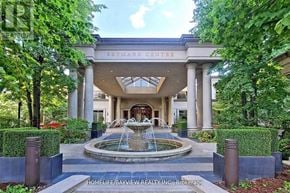 Toronto (Willowdale East) condo for rent - A fountain is in front of a building called Skimark Centre.