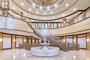 Toronto (Willowdale East) condo for rent - A grand foyer with a fountain and a staircase.