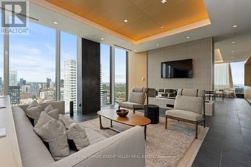 Toronto (Church-Yonge Corridor) condo for rent - A living room with a large couch and a television.
