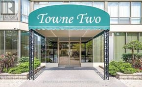 Mississauga (City Centre) condo for rent - The entrance to a building named Towne Two with a glass door.