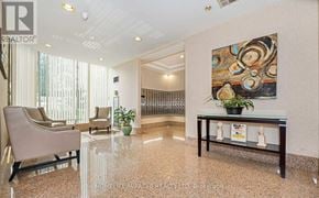 Mississauga (City Centre) condo for rent - A waiting area with a large painting on the wall.