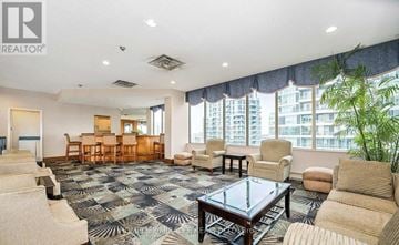 Mississauga (City Centre) condo for rent - A living room with a glass table and a sofa.