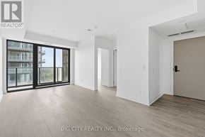 Toronto (Thorncliffe Park) condo for rent - A spacious room with a view of a building through the windows.