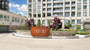 Toronto (Bayview Village) condo for rent - A sign for a place called "Empire" is in front of a building.