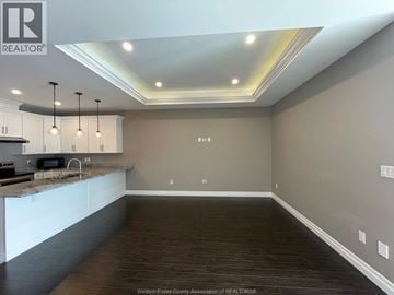 Windsor townhouse for rent - A kitchen with a counter top and cabinets.