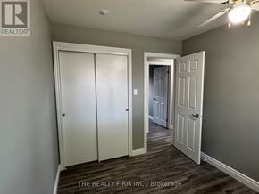 London South (South X) apartment for rent - A hallway with a white door on the left and a white door on the right.