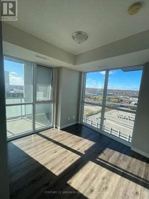 Burlington (Freeman) condo for rent - A room with a view of a parking lot and trees.