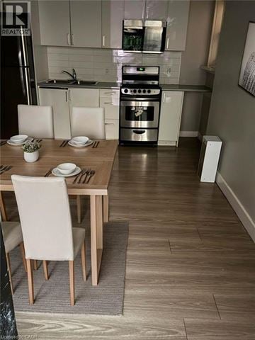 Hamilton apartment for rent - A modern kitchen with a dining table set for two.
