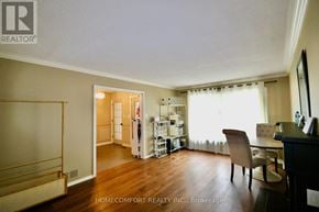 Aurora (Aurora Highlands) apartment for rent - A room with a chair and a table in it.